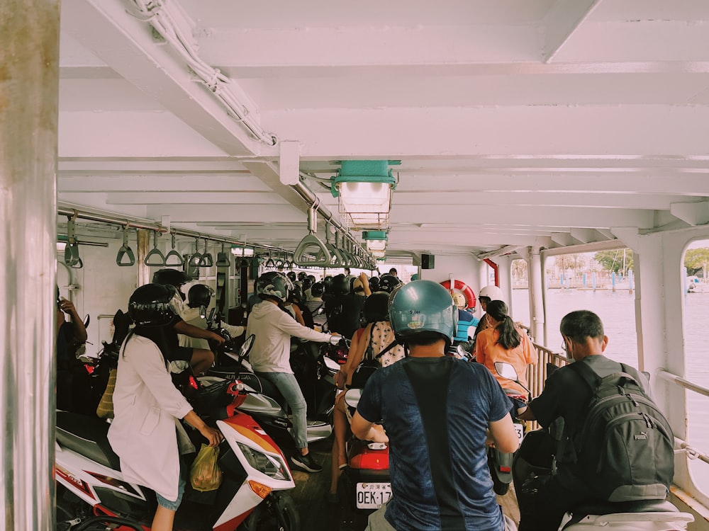 a group of people riding scooters on a boat