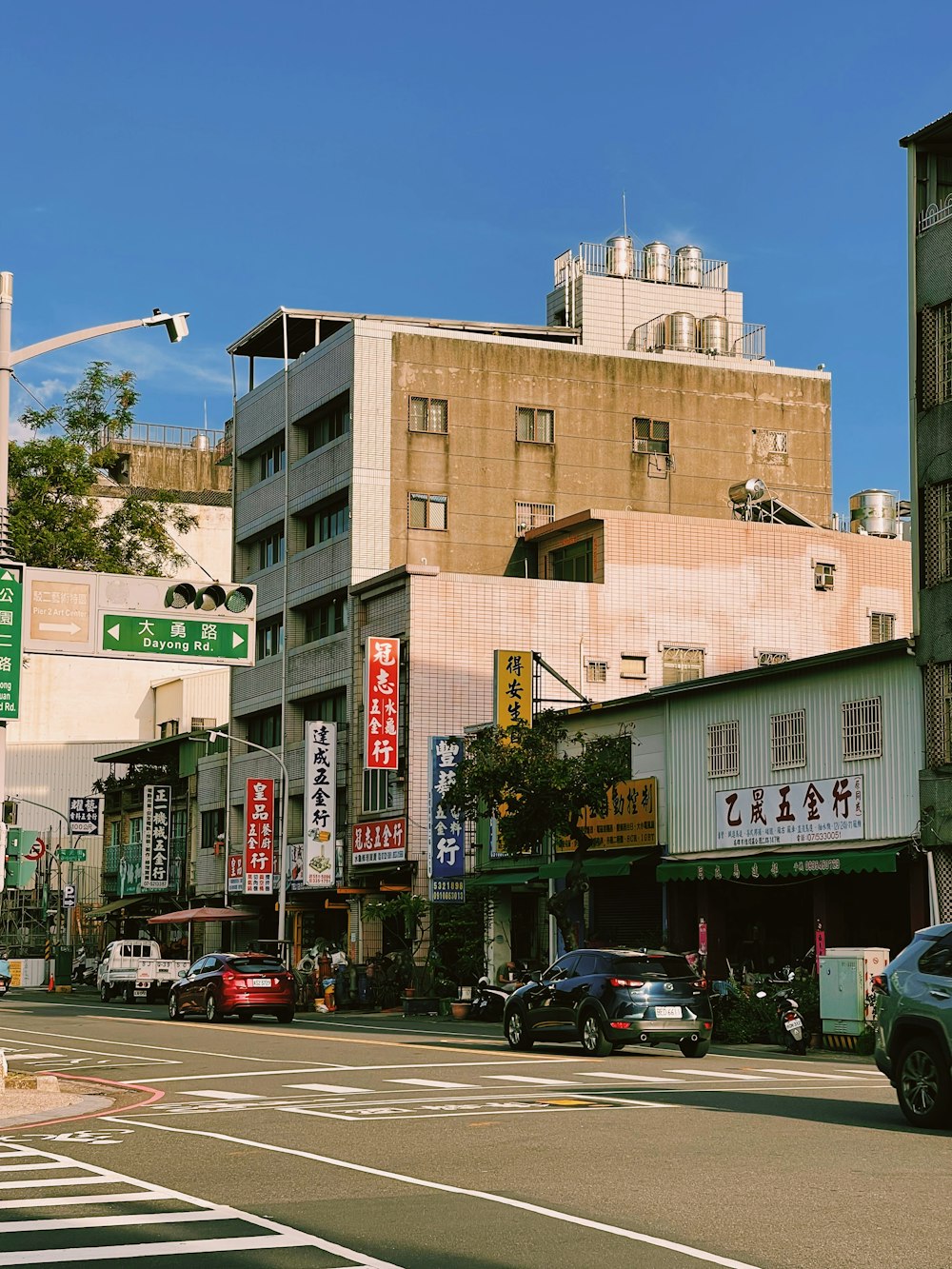 a city street filled with lots of tall buildings