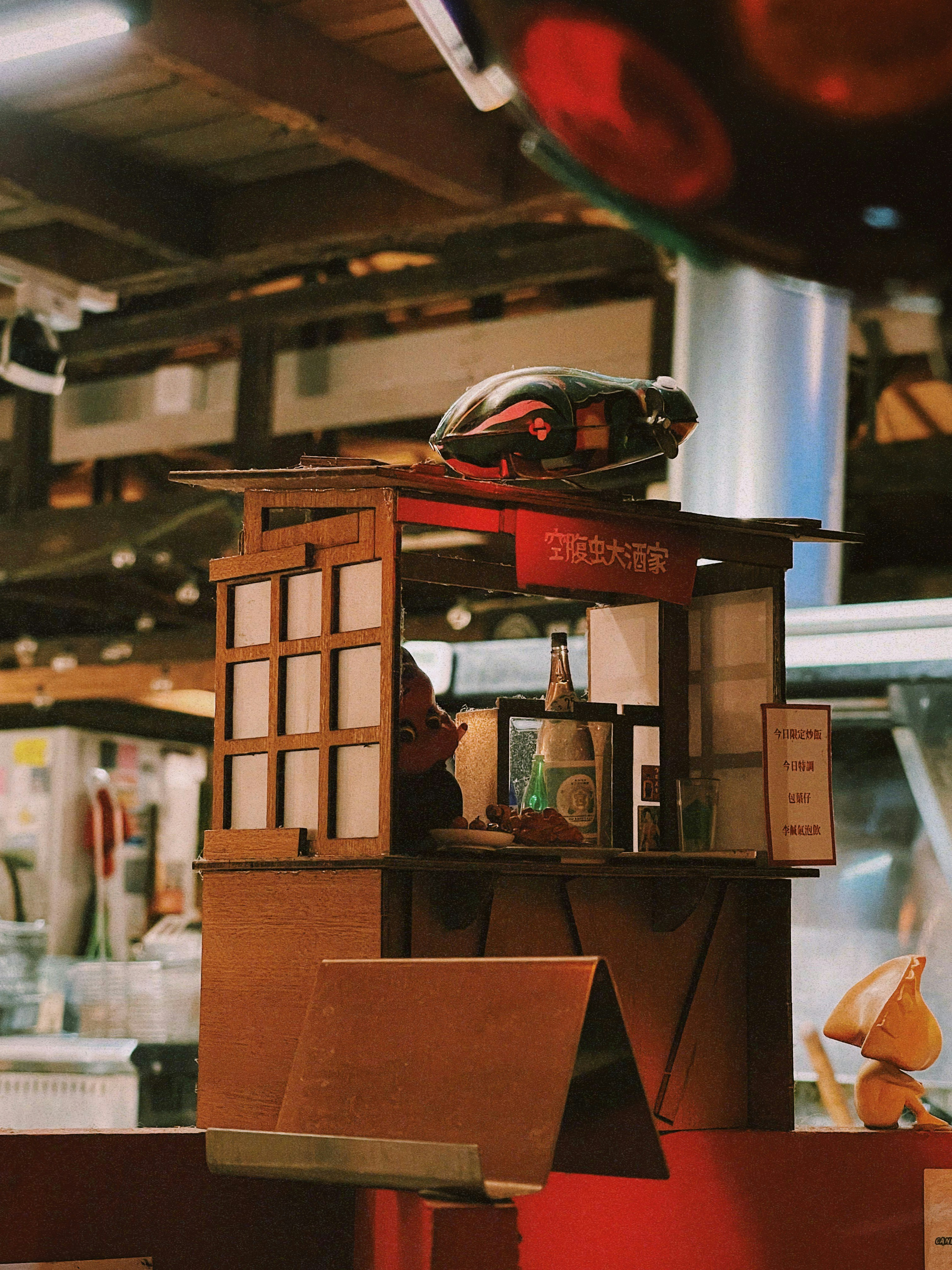 A Box Compression Test (BCT) machine applying force to a corrugated box.