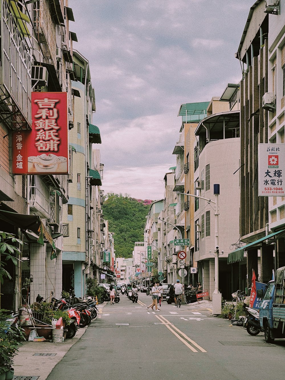 a city street filled with lots of tall buildings