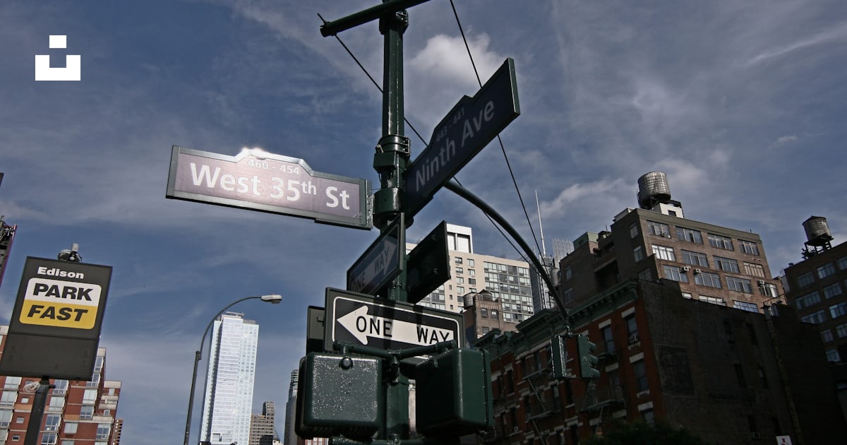 A street light with street signs on it photo – Free Ninth ave Image on ...