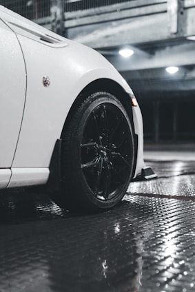 a white car parked in a parking garage