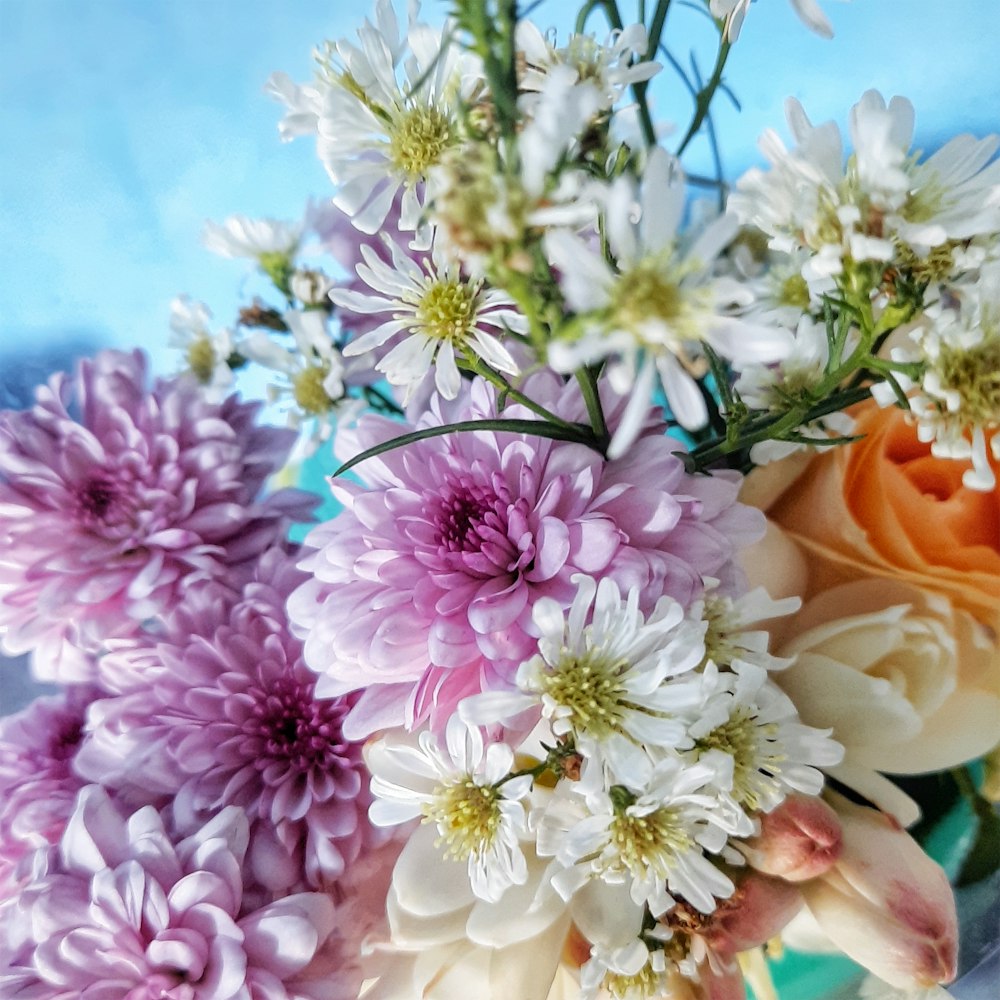 a bunch of flowers that are in a vase