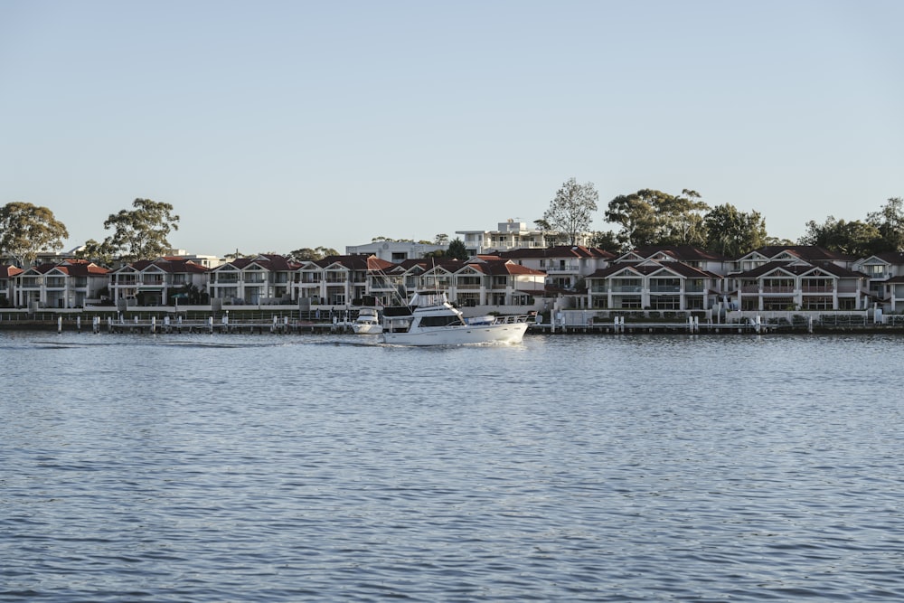 a large body of water with a bunch of houses in the background