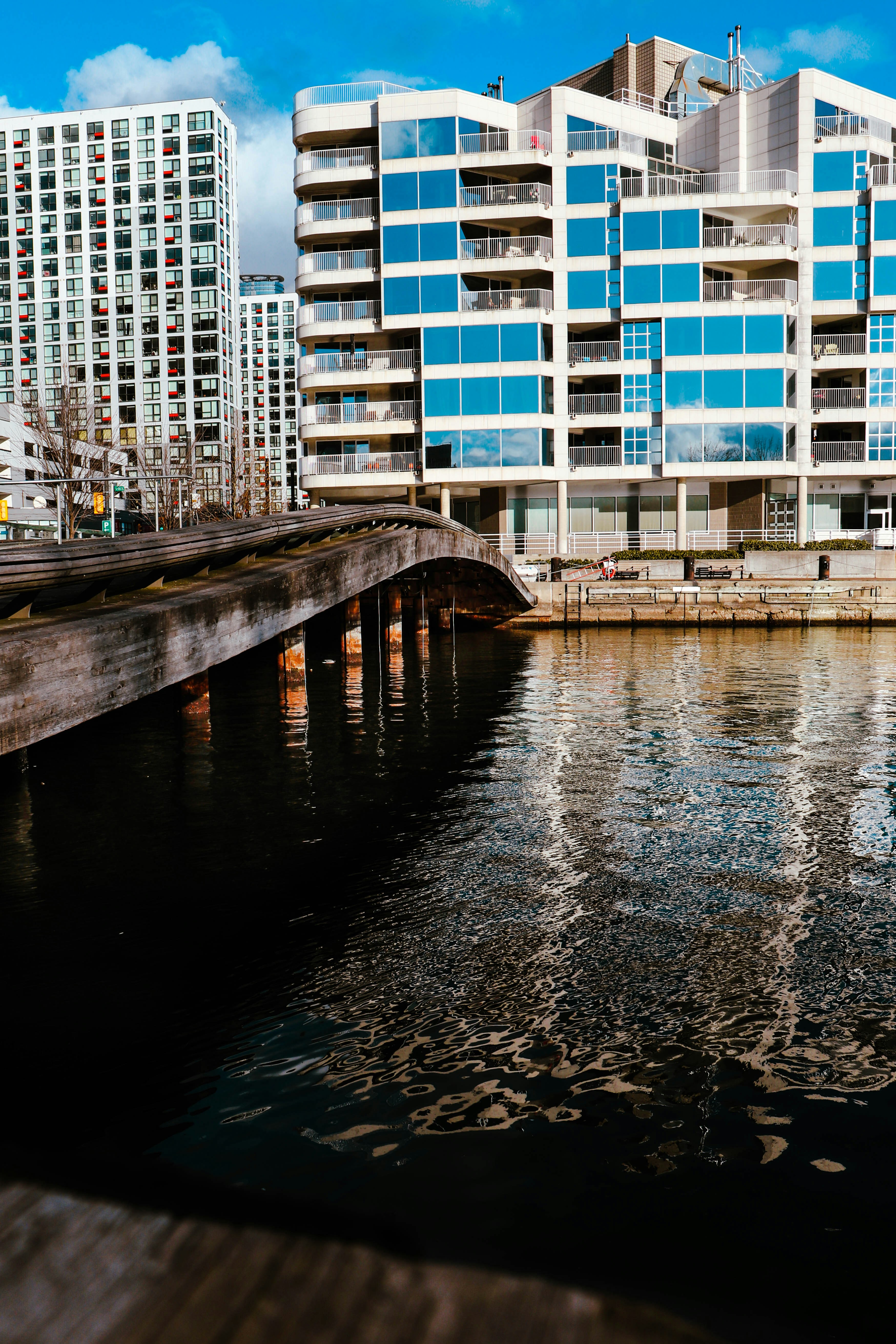 a body of water with a building in the background