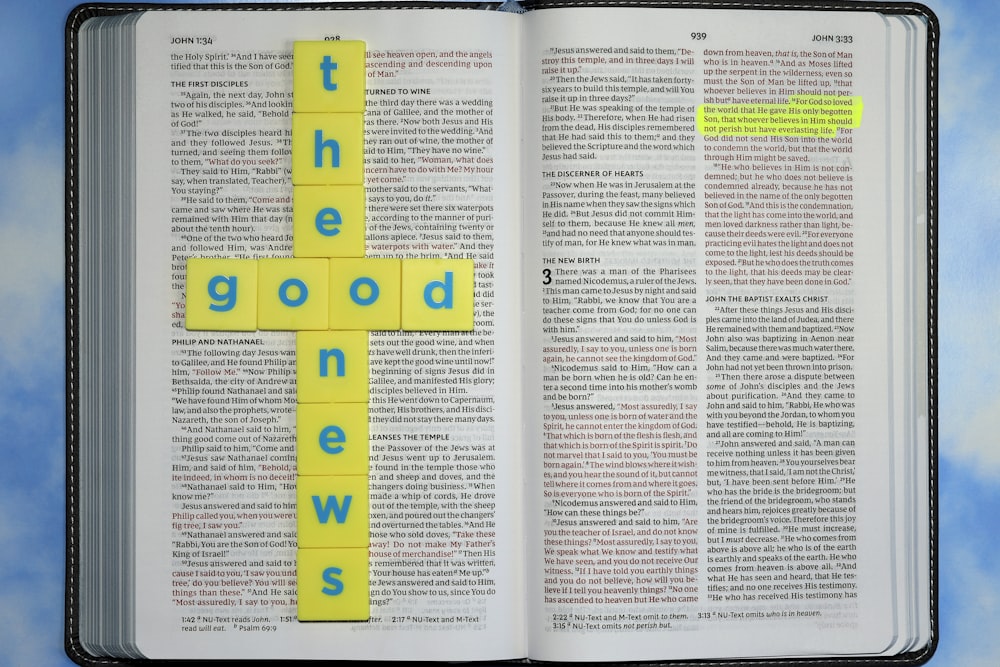 a book with a cross made out of yellow paper