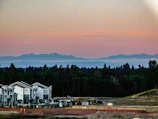 Sunset view over a premium plot development site with ongoing construction