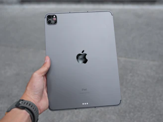 Technician testing an iPad after repair to ensure perfect functionality.