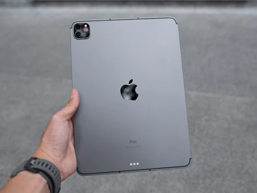 Technician testing an iPad after repair to ensure perfect functionality.