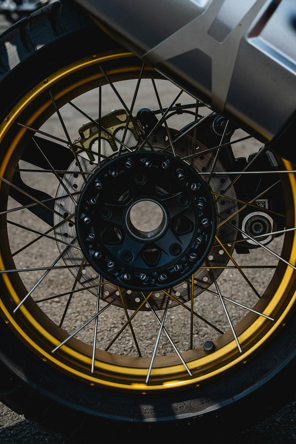 a close up of a motorcycle tire and spokes