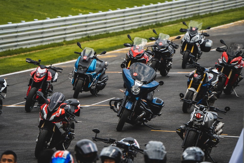a group of motorcycles parked in a parking lot
