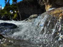 Close-up of clear, sparkling water flowing from a natural mineral spring.