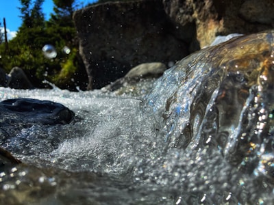 Close-up of clear, sparkling water flowing from a natural mineral spring.