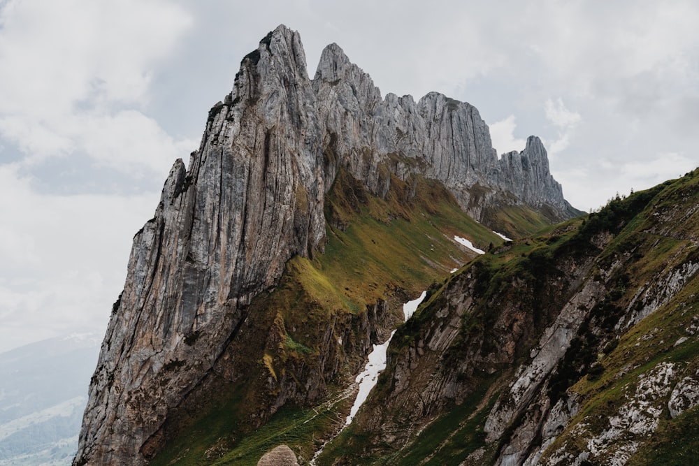 a person walking up a mountain with a backpack