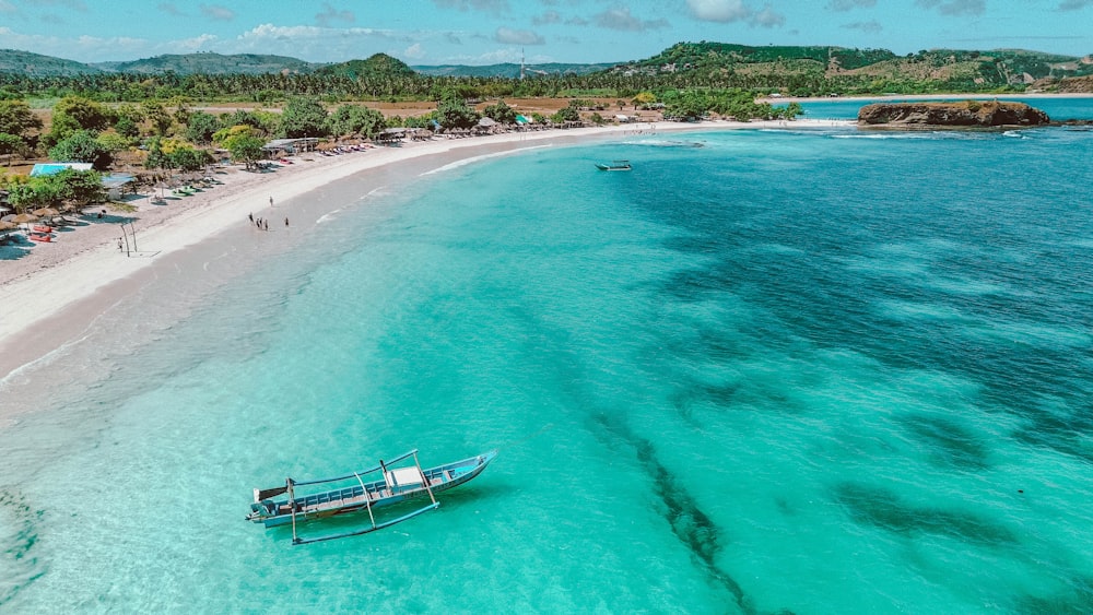 a boat on a beach near the ocean