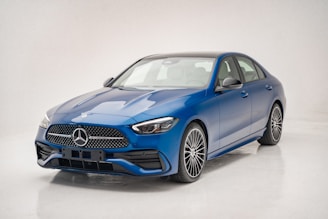 A 3D render of a sleek, modern vehicle design in a studio setting.