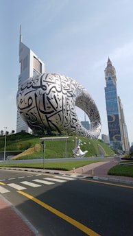 a giant turtle sculpture in front of a building