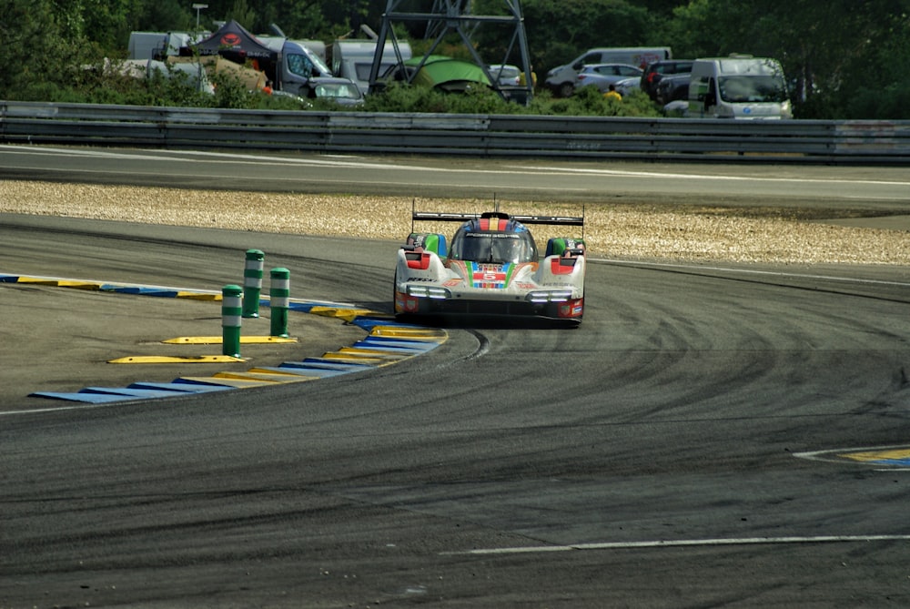 a car driving on a race track in a race