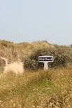 a sign that is in the middle of a field