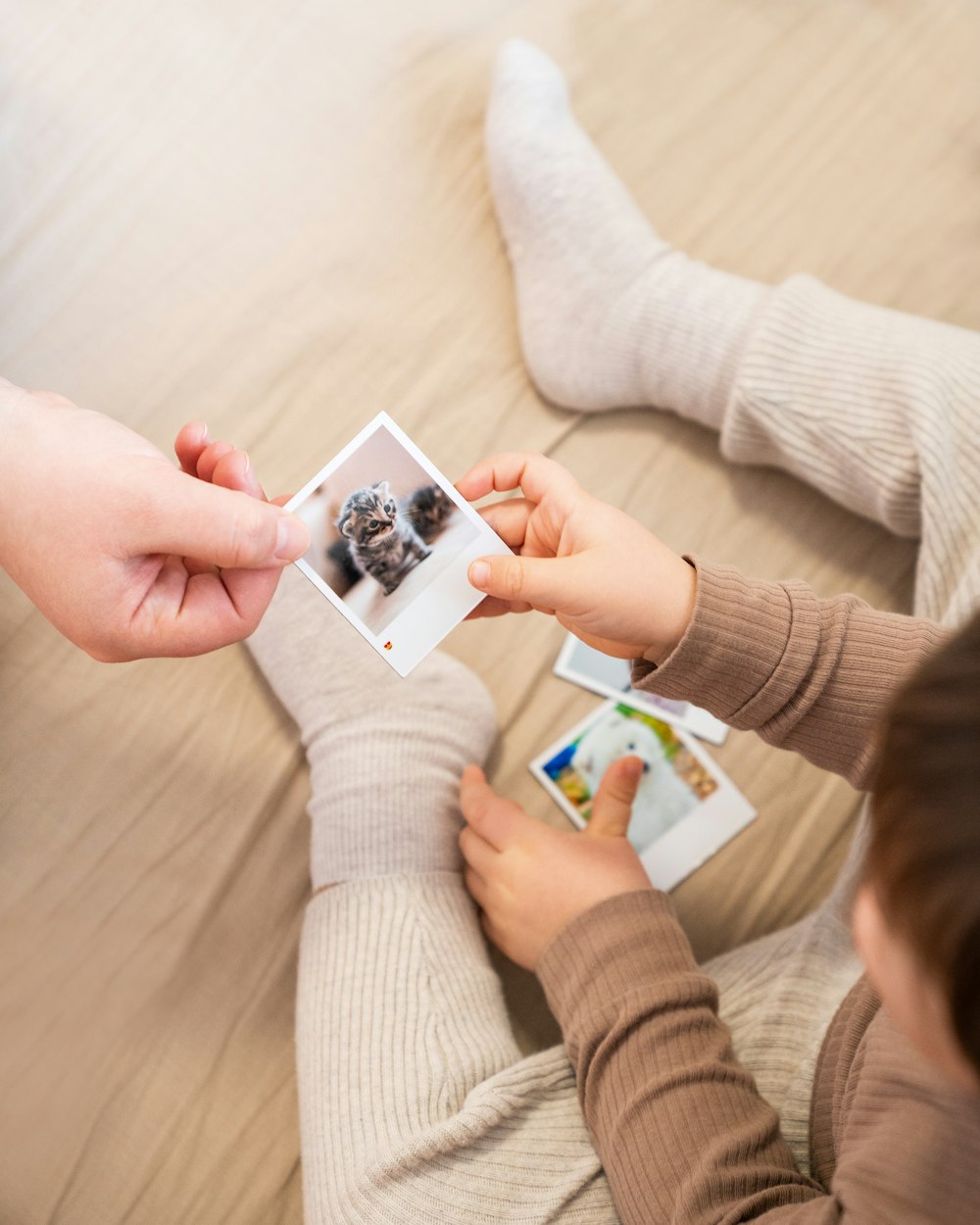 a person is holding a picture of a dog