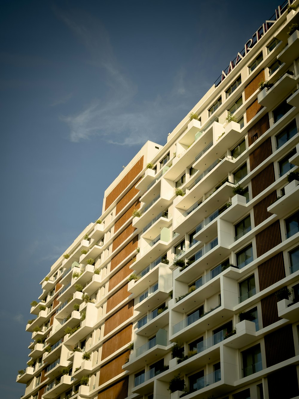 a tall building with balconies and balconies on it