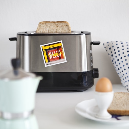 A stylish bread toaster on a kitchen countertop.