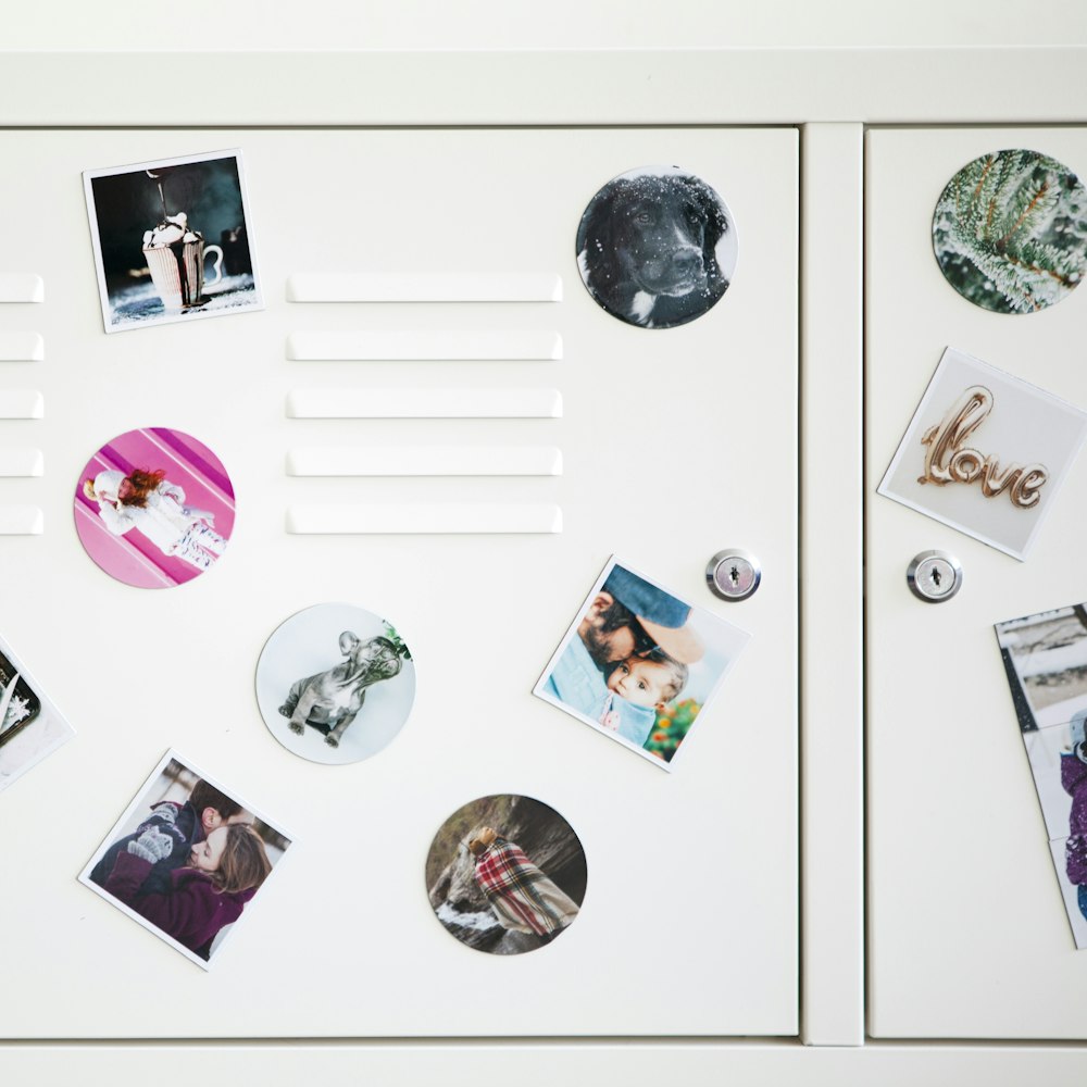 a white refrigerator with magnets and pictures on it