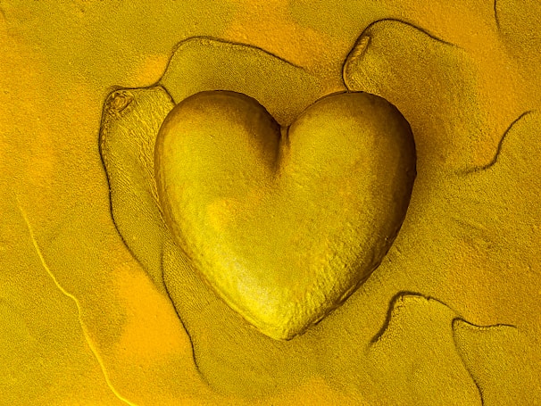 Artisan crafting traditional African pottery vessels with gold accents, symbolizing the heart of daking’s™ production process.