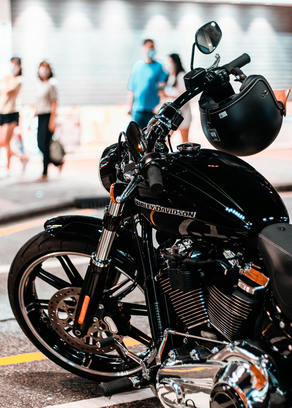 a black motorcycle parked on the side of the road