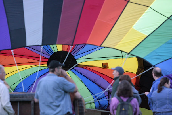 Setup crew carefully arranging an inflatable at a school event, showcasing professionalism and care.