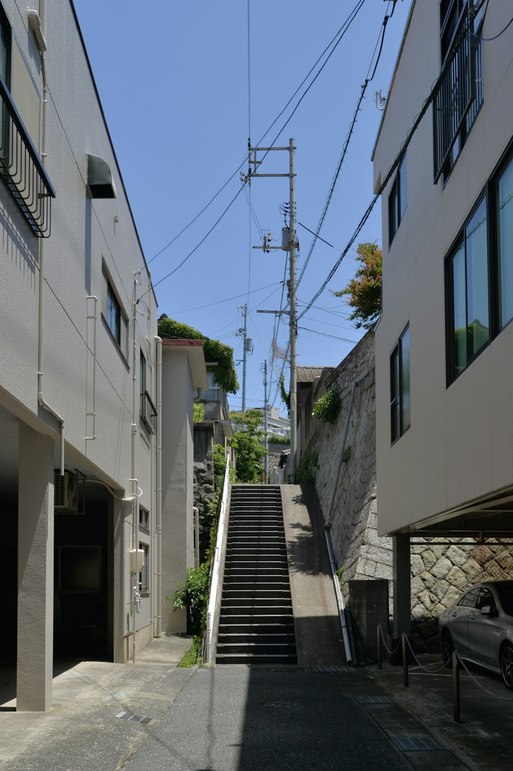 a set of stairs leading up to a parking garage