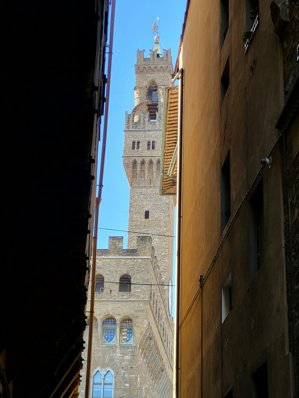 a tall clock tower towering over a city