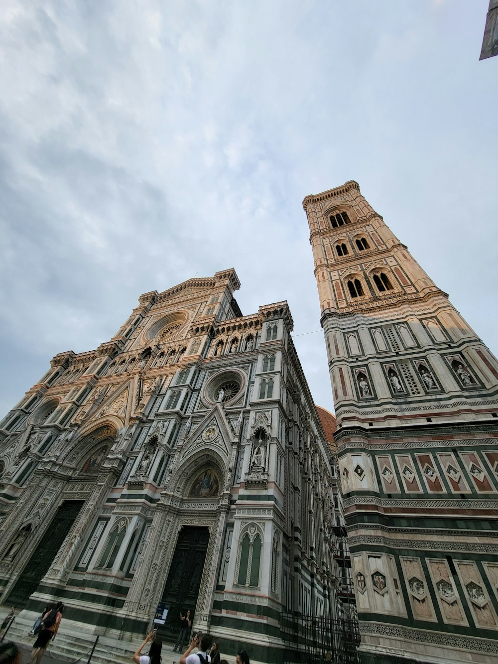 a large cathedral with two towers and a sky background