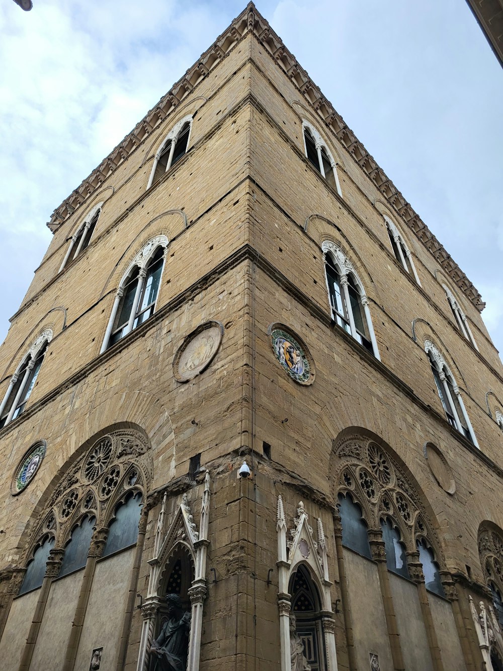 a tall building with a clock on the side of it