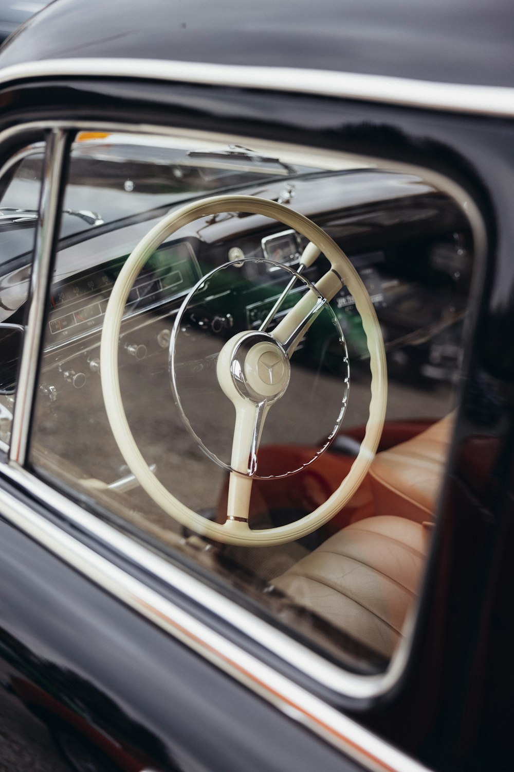 a person holding a steering wheel in a car