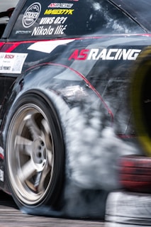 An action shot of a stock car during a race.