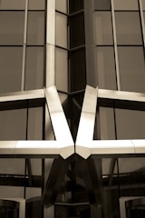 Close-up of a polished metal structure framing a contemporary storefront.