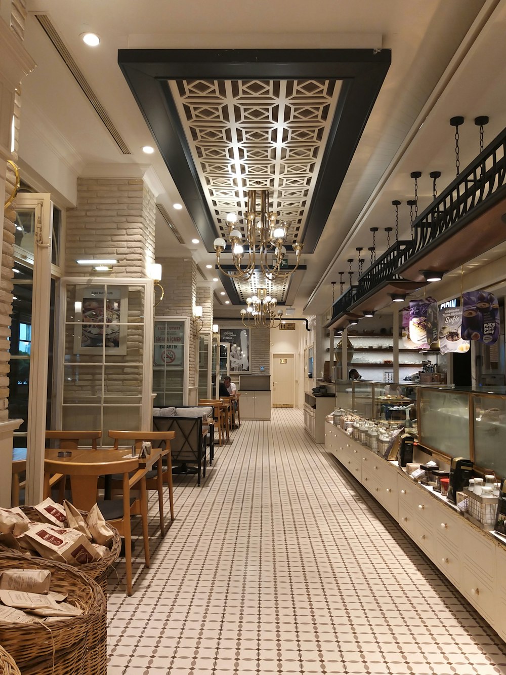 a restaurant filled with lots of tables and chairs