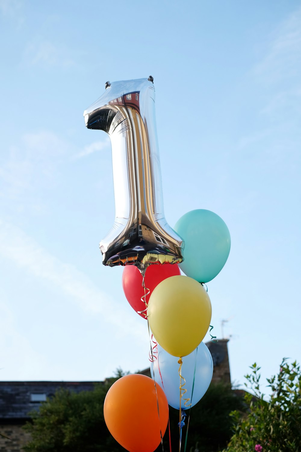 A number one balloon attached to a bunch of balloons photo – Free