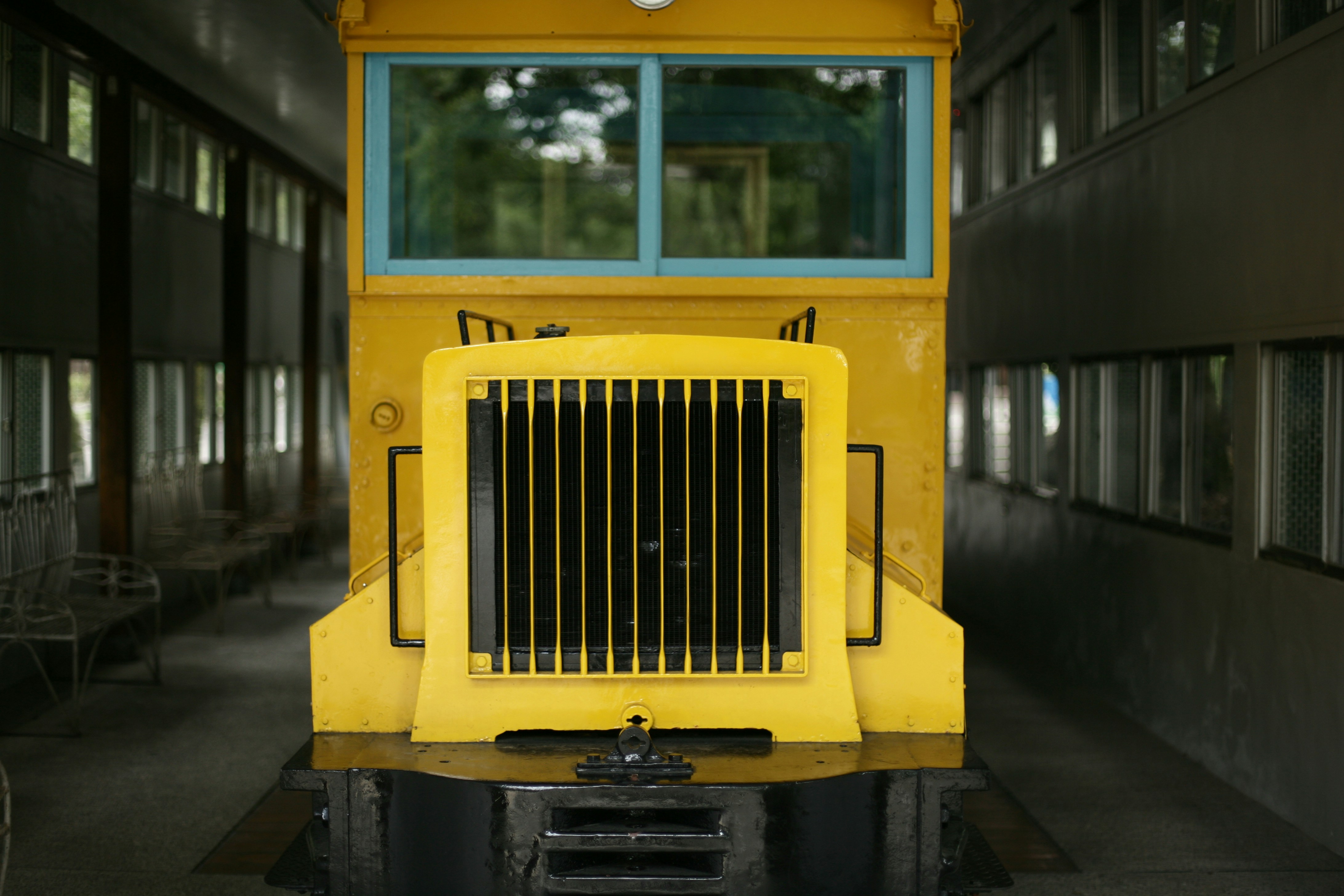 a yellow school bus parked inside of a building