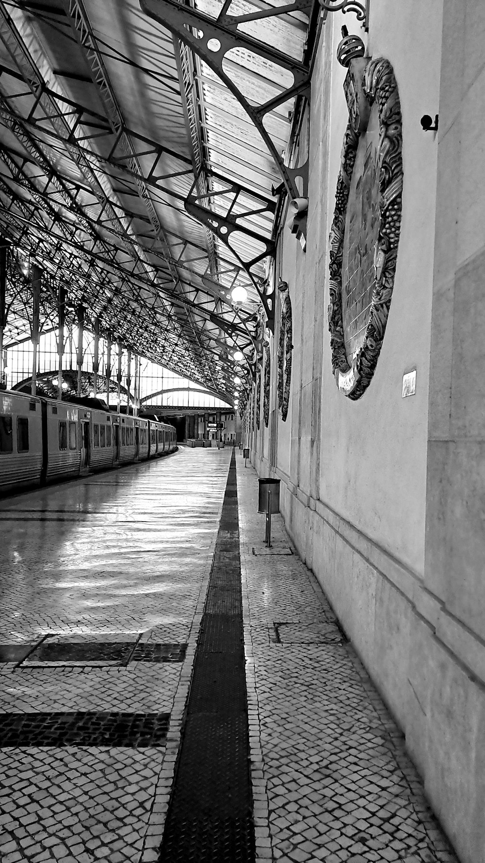 a black and white photo of a train station