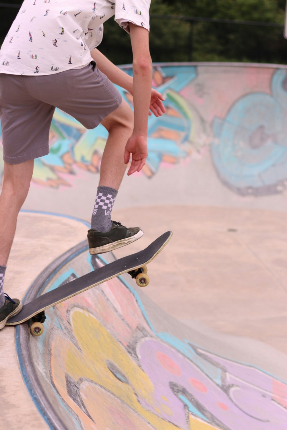 a man riding a skateboard up the side of a ramp