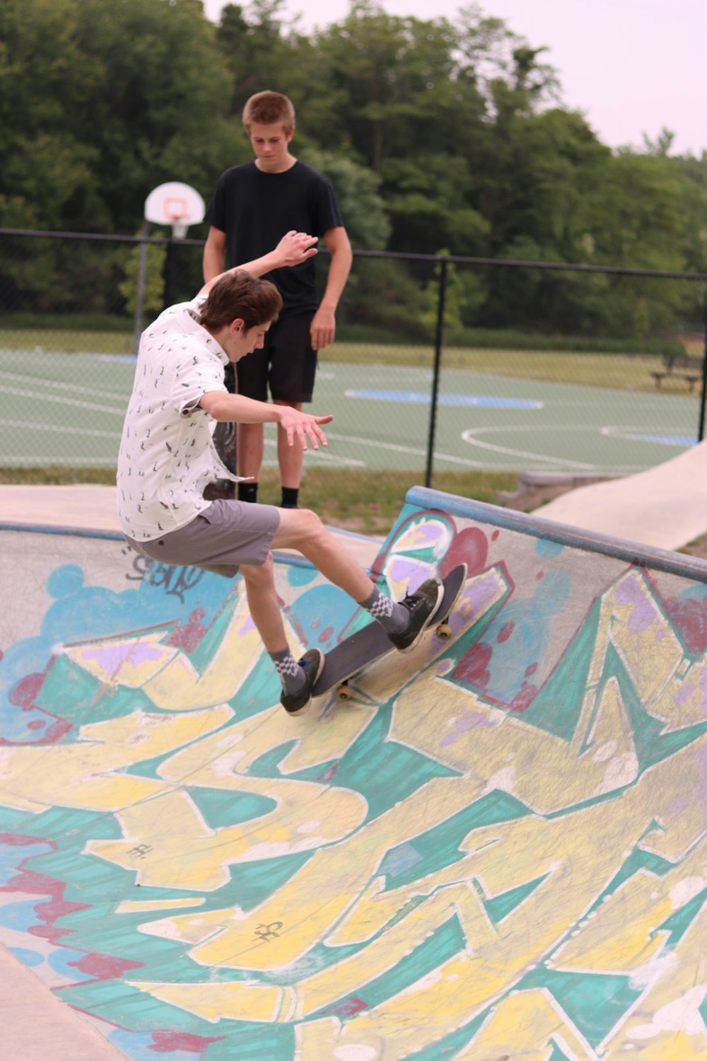 a man riding a skateboard up the side of a ramp