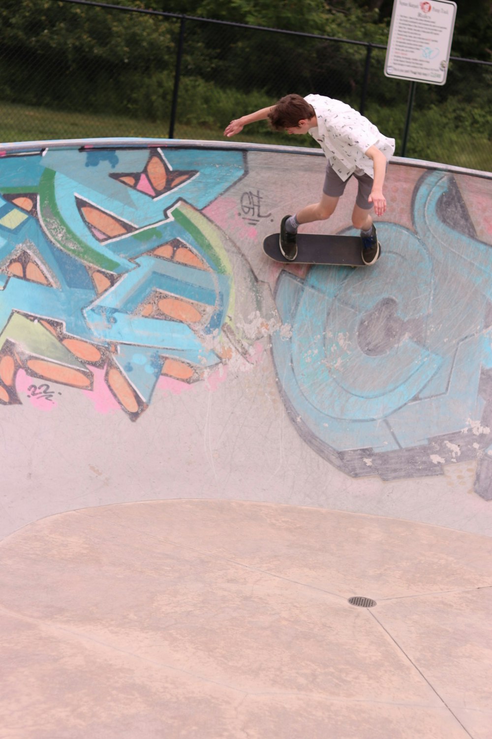 a man riding a skateboard up the side of a ramp