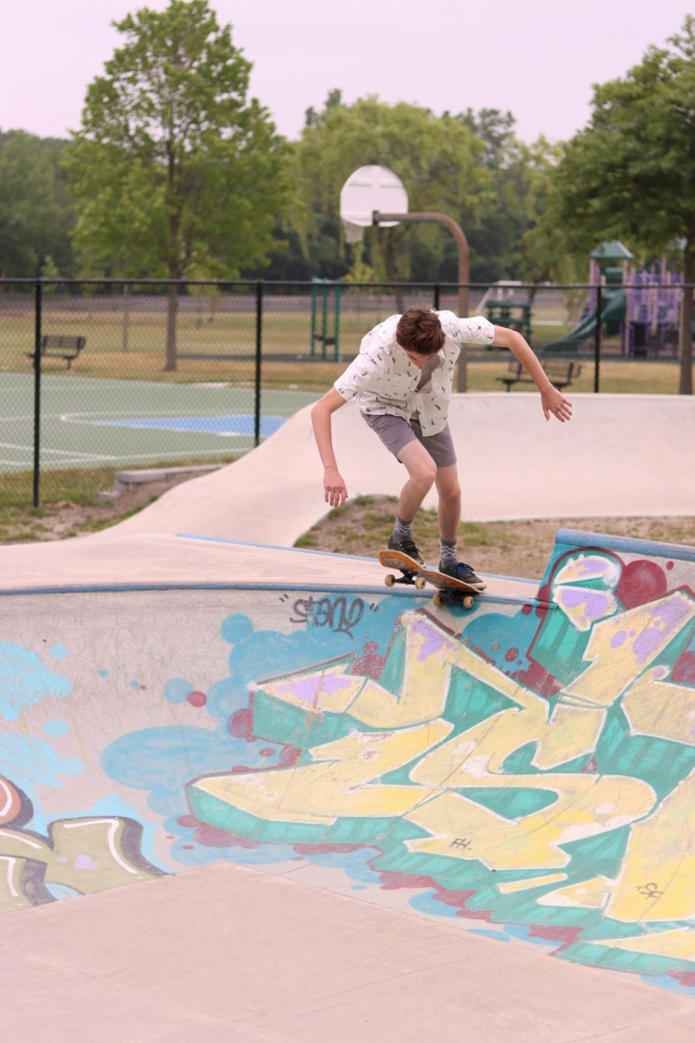 a man riding a skateboard up the side of a ramp