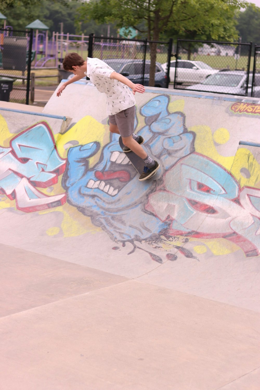 a man riding a skateboard up the side of a ramp