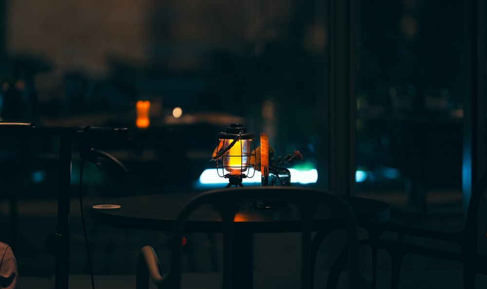 a table with a lamp sitting on top of it