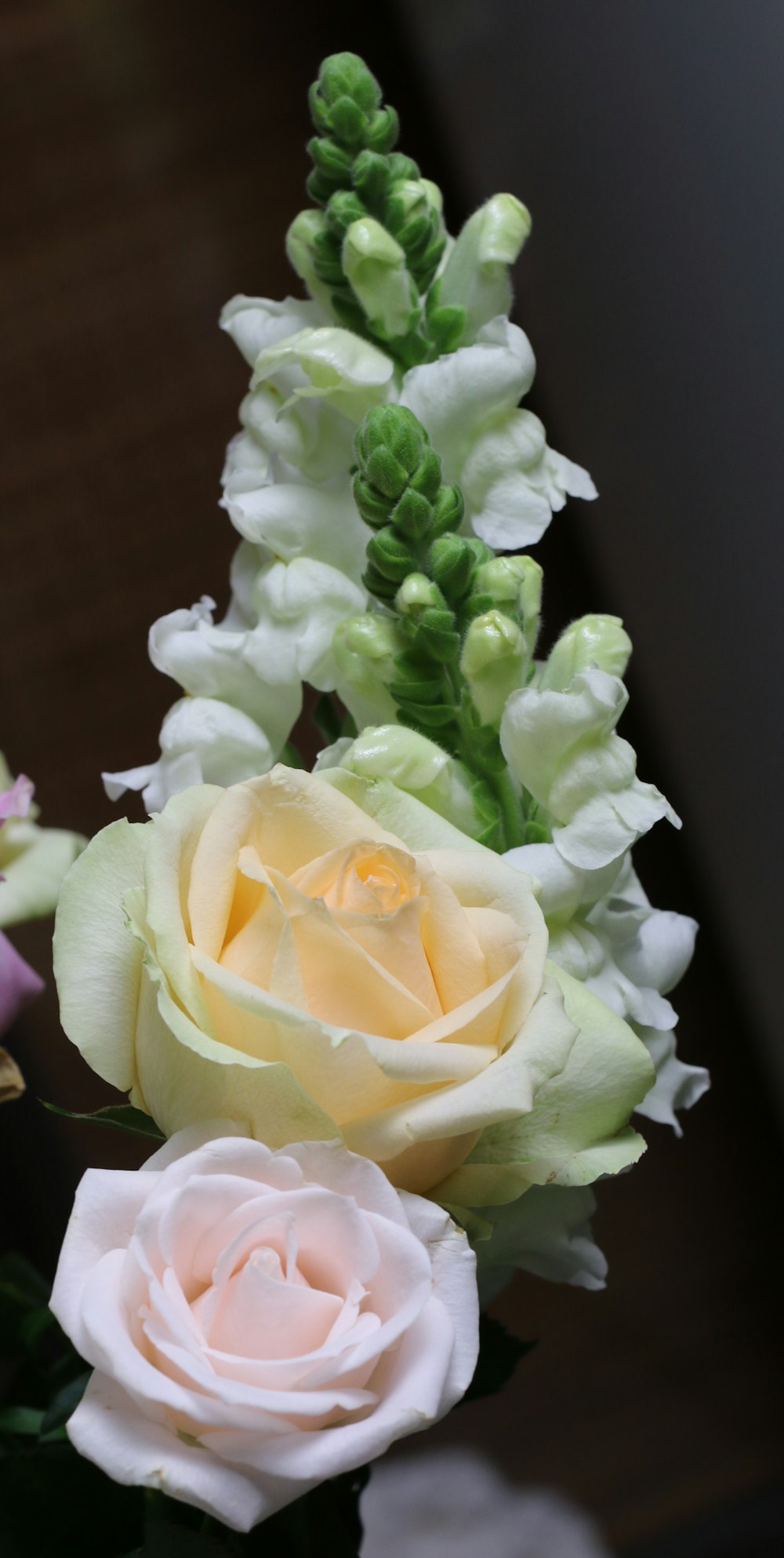 a close up of a bouquet of flowers on a table