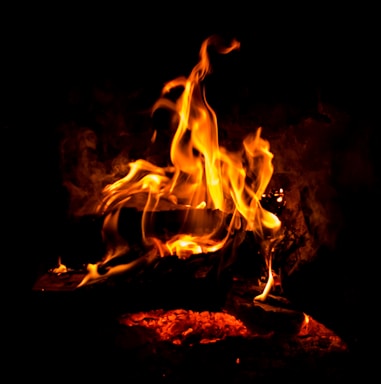 a close up of a fire in the dark