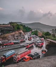 a group of trucks parked next to each other on a road